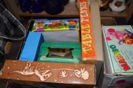 Assorted childrens toys to include table tennis, pop and catch, dinosaur operation and others