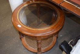 Circular coffee table with cane bottom tier