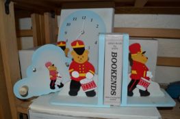 A pair of childrens wood teddy bear bookends together with a matching wall clock and coat hook