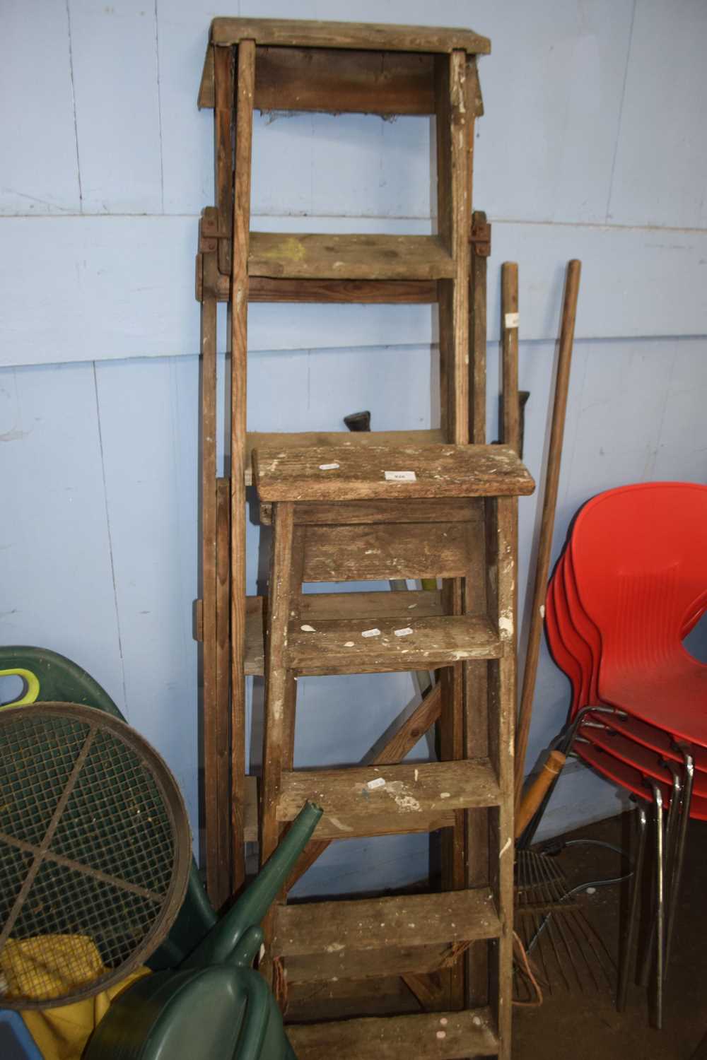 Two folding wooden step ladders