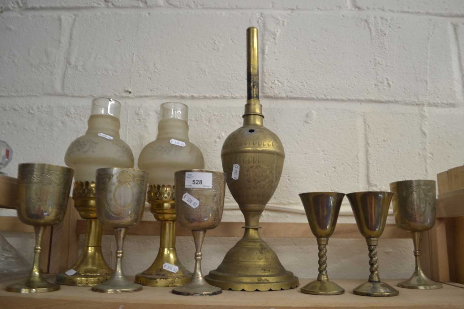 Mixed brass candle stand, goblets, brass lamp base etc