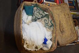 Wicker linen basket full of table cloths etc