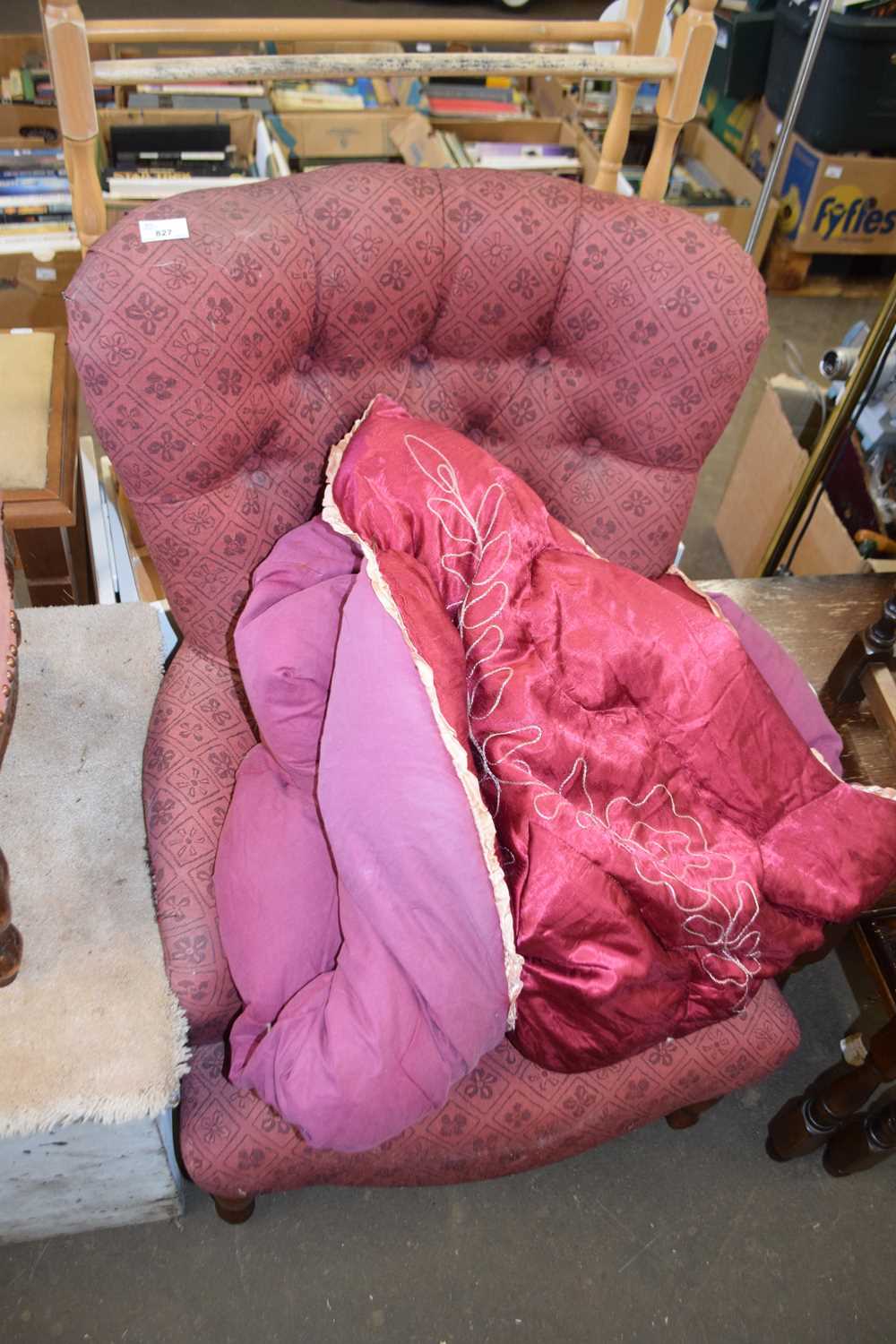 Pink cloth button back armchair with wooden turned legs together with red and purple eiderdown