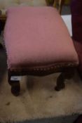 Pink cloth covered foot stool