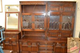 A dresser with glazed doors, cupbboads and shelves below approx 183 cm wide