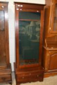 20th Century mahogany framed gun cabinet with wedge formed top section, single glazed door and a