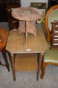 Small octagonal oak two tier side table on casters together with a Far Eastern circular top