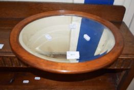 Small oval bevelled wall mirror