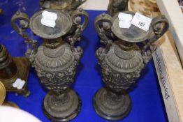 Pair of 19th Century brass double handled garniture vases with classical decoration