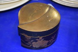 Japanese lacquer box of shaped form with a gilt decoration of flowers to the base and cover, 10cm