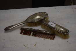 Silver backed three piece dressing table brush/comb set