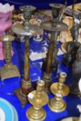 Pair of brass candlesticks together with a further pair of large lacquered finish metal candlesticks