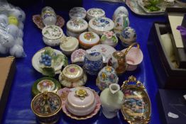 Collection of various porcelain trinket boxes and egg shaped ornaments