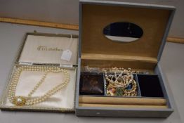 A pale grey jewellery box and contents to include a three strand faux pearl choker, brooches,