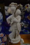 A Royal Worcester style parian figure of a water carrier on circular base, 42cm high