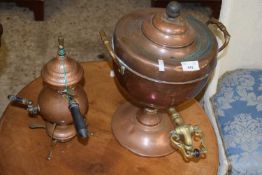 Copper tea urn or samovar together with a German copper coffee pot with burner beneath