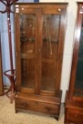 20th Century dark oak framed two door glazed gun cabinet with drawer base, 168cm high