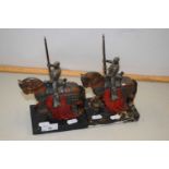 A pair of modern cast metal models of Knights set on polished marble bases