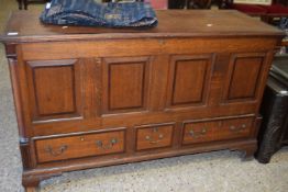 Georgian oak mule chest with four panelled front over three drawers with swan neck handles raised on