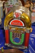 Novelty Coca Cola storage jar formed as a juke box