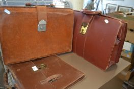 Three leather briefcases