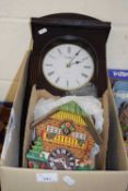 Box of mixed items to include a modern wall clock and a modern cuckoo clock