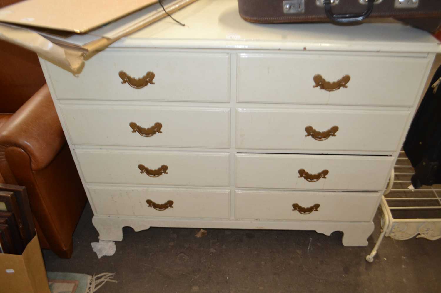 A white painted pine chest of eight drawers