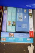 One box of various jigsaw puzzles
