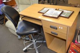 Modern office desk together with a black adjustable office chair