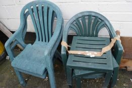 Mixed plastic garden chairs and table