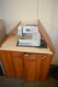 A Bernina Activa 145 sewing machine and integral fold out work station