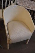 Cream painted and ivory upholstered wicker chair