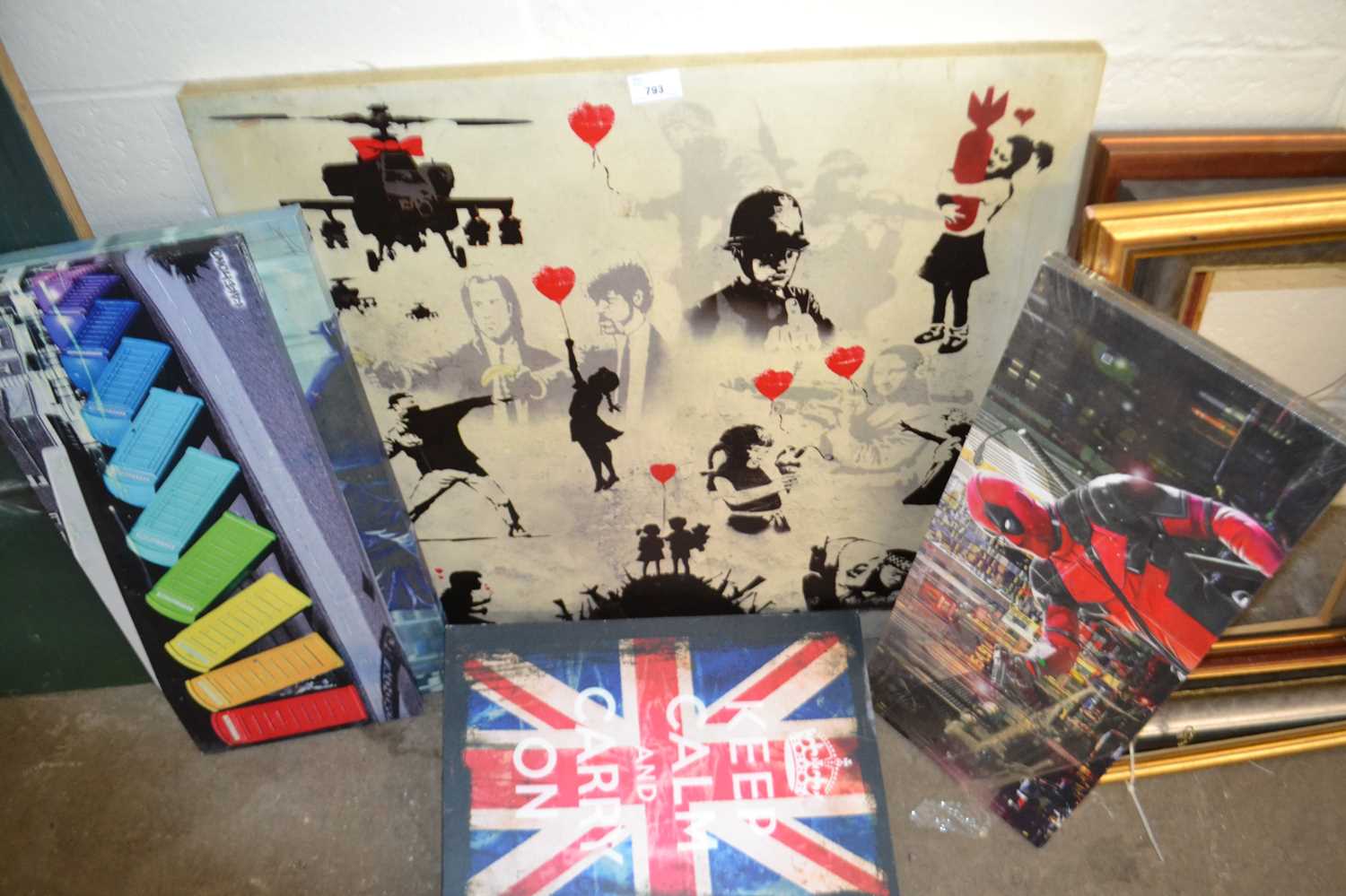 Five contemporary canvas prints including one by Banksy