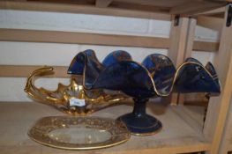 A blue glass tazza with gilt decoration and rippled form together with a gilt glass dish and another