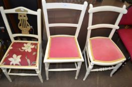Three cream painted dining chairs