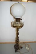 Victorian oil lamp with cast metal base later converted to electricity