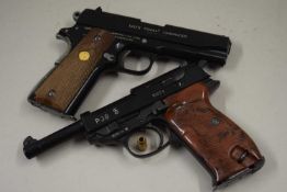 Two replica pistols