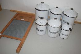 Six French enamel kitchen storage jars and a small wooden framed washboard