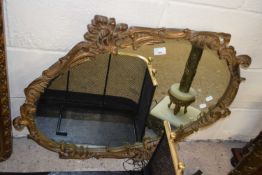 Reproduction oval bevelled wall mirror in gilt foliate frame