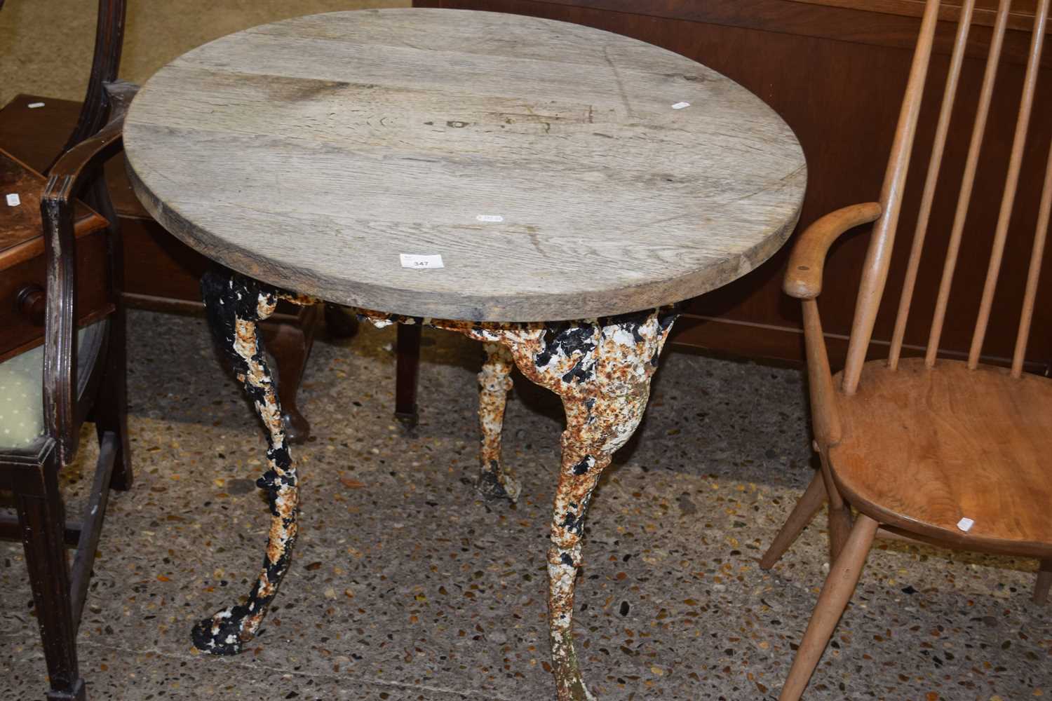 Cast base pub table with oak top, the top is 75cm diameter