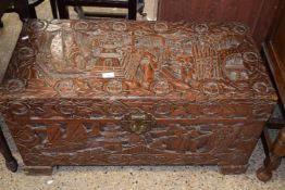 20th Century Chinese camphor wood blanket box with extensive carved detail, 94cm wide