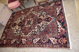 Middle Eastern wool floor rug with large central panel, 215 x 160cm