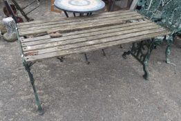 Iron framed and wooden topped garden table