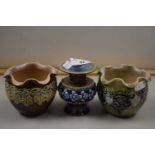 Group of three small Doulton stone ware vases