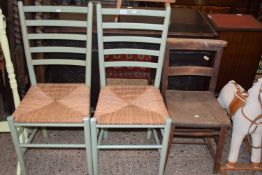 Pair of rush seated kitchen chairs together with a further elm seated chair (3)