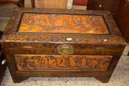 Chinese camphor wood blanket box with extensive carved decoration, 100cm wide