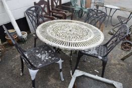 Cast metal garden table and four chairs
