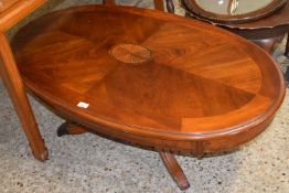 Oval topped reproduction coffee table on outswept legs, 120cm wide