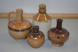 Collection of four Doulton miniature jugs and bottles