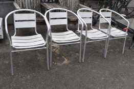 Four modern metal cafe chairs